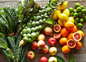 a group of fruits and vegetables on a wood surface Healthy Weight Loss Diets Royal Leamington Spa