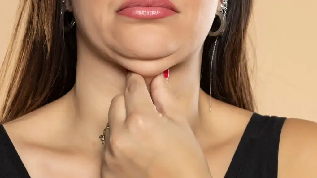 An image of a woman with double chin, sad, worried : Non Surgical Double Chin Removal Treatment in Royal Leamington Spa, UK